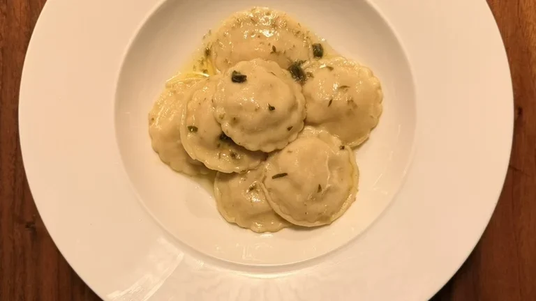 Smoked fish ravioli with caper butter